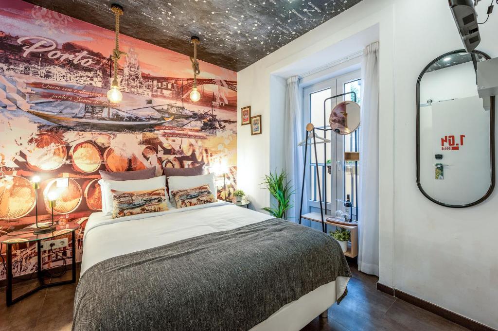 a bedroom with a bed and a wall mural at Lisbon Wine House - Rooms & Suites in Lisbon