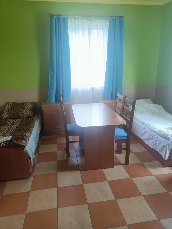 Posteľ alebo postele v izbe v ubytovaní Gościniec