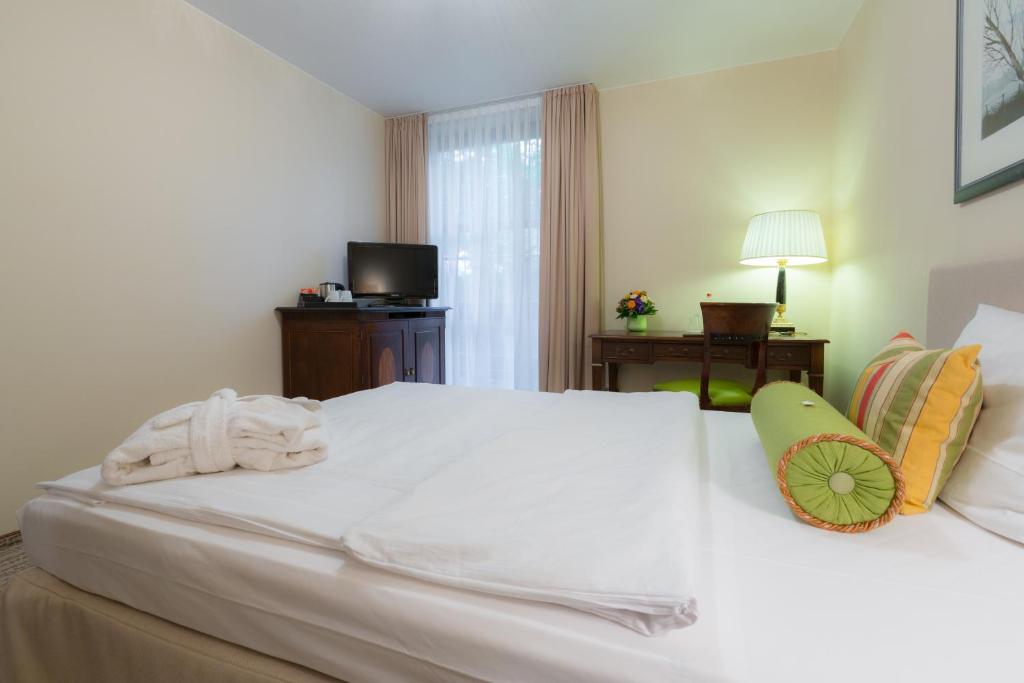 Postel nebo postele na pokoji v ubytování Hotel Engel