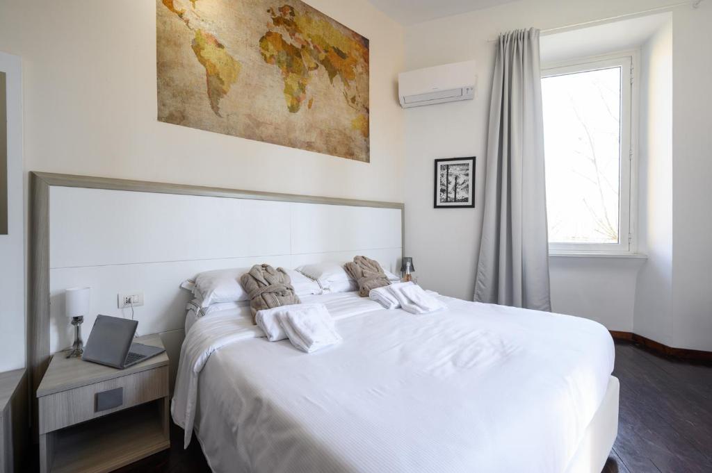 A bed or beds in a room at Relais Incantesimo Vaticano