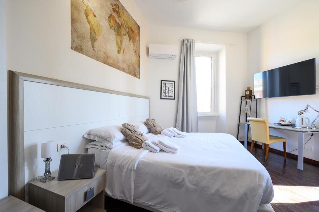 A bed or beds in a room at Relais Incantesimo Vaticano