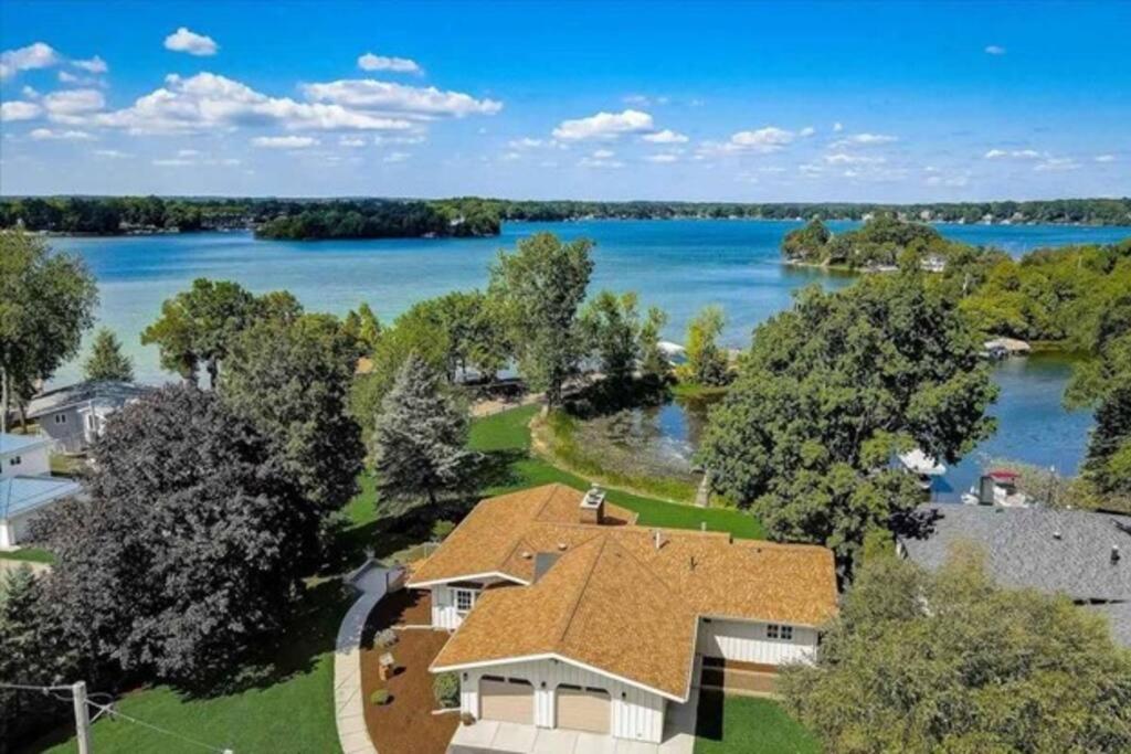 an aerial view of a house with a lake at Bayside Beach House in Burlington