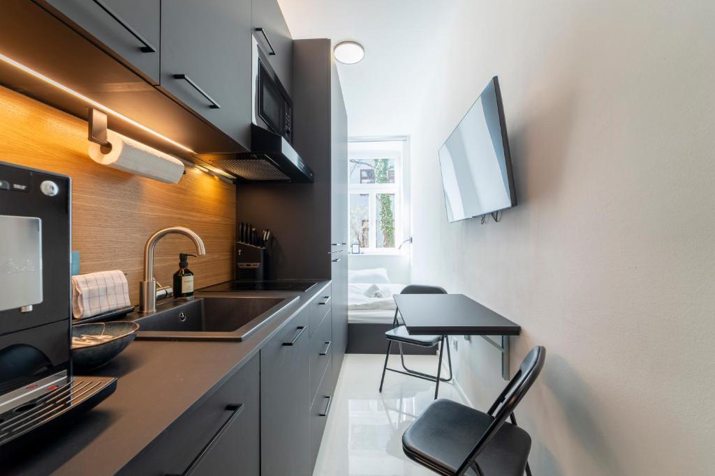 A kitchen or kitchenette at josef's home I Studio Mini I near UNO & VIC