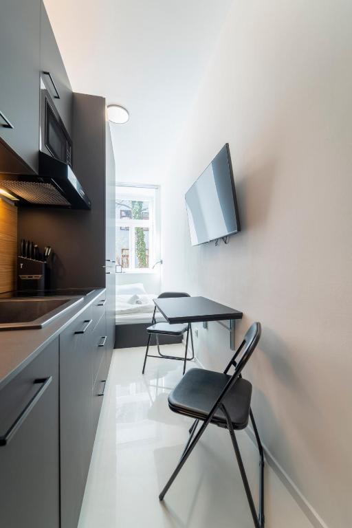 A kitchen or kitchenette at josef's home I Studio Mini I near UNO & VIC
