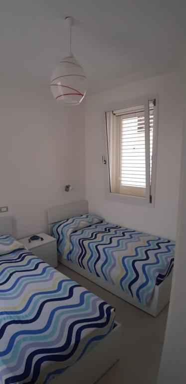A bed or beds in a room at Casa Sole