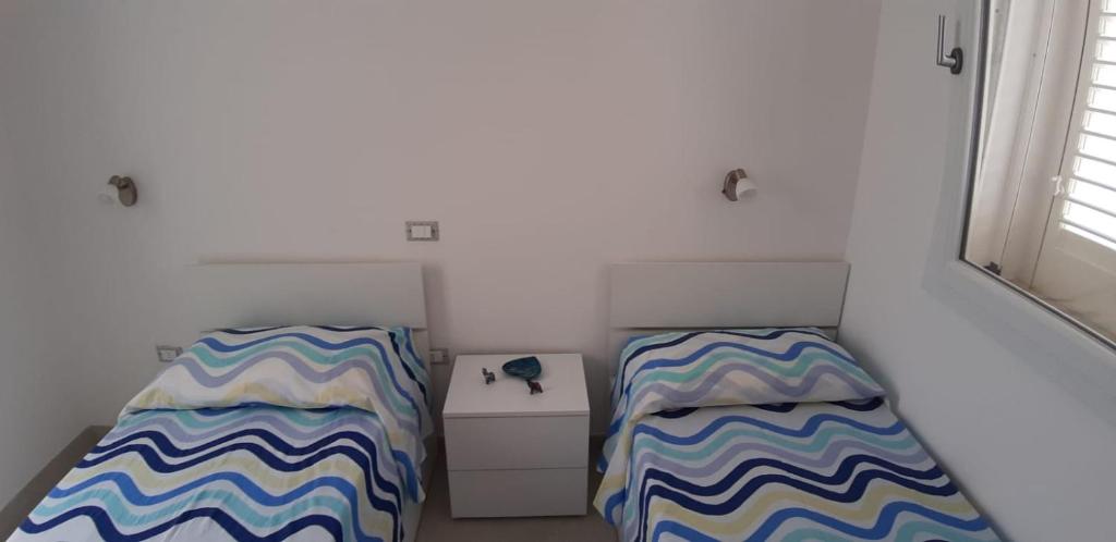 A bed or beds in a room at Casa Sole