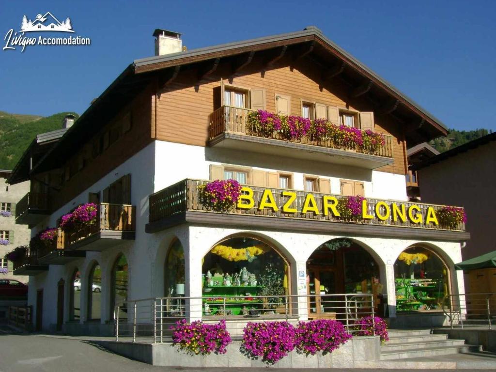 a building with a baja lounge sign on it at Residence Casa Longa in Livigno