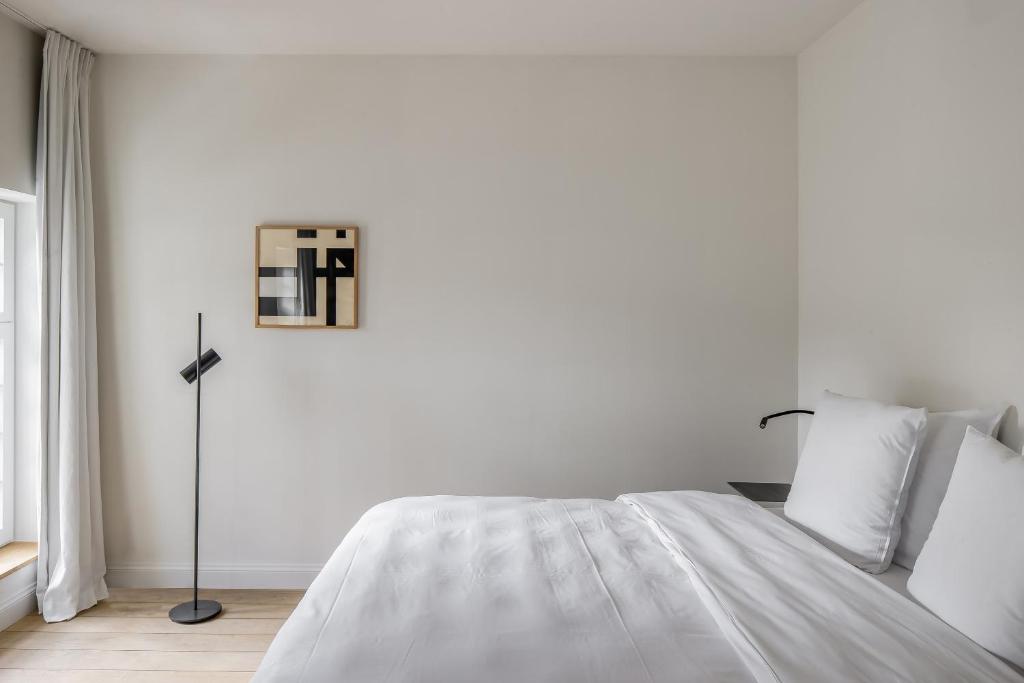 Postel nebo postele na pokoji v ubytování Hotel Nenuphar