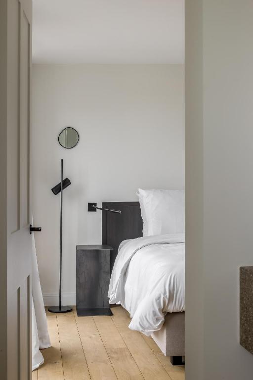 Postel nebo postele na pokoji v ubytování Hotel Nenuphar