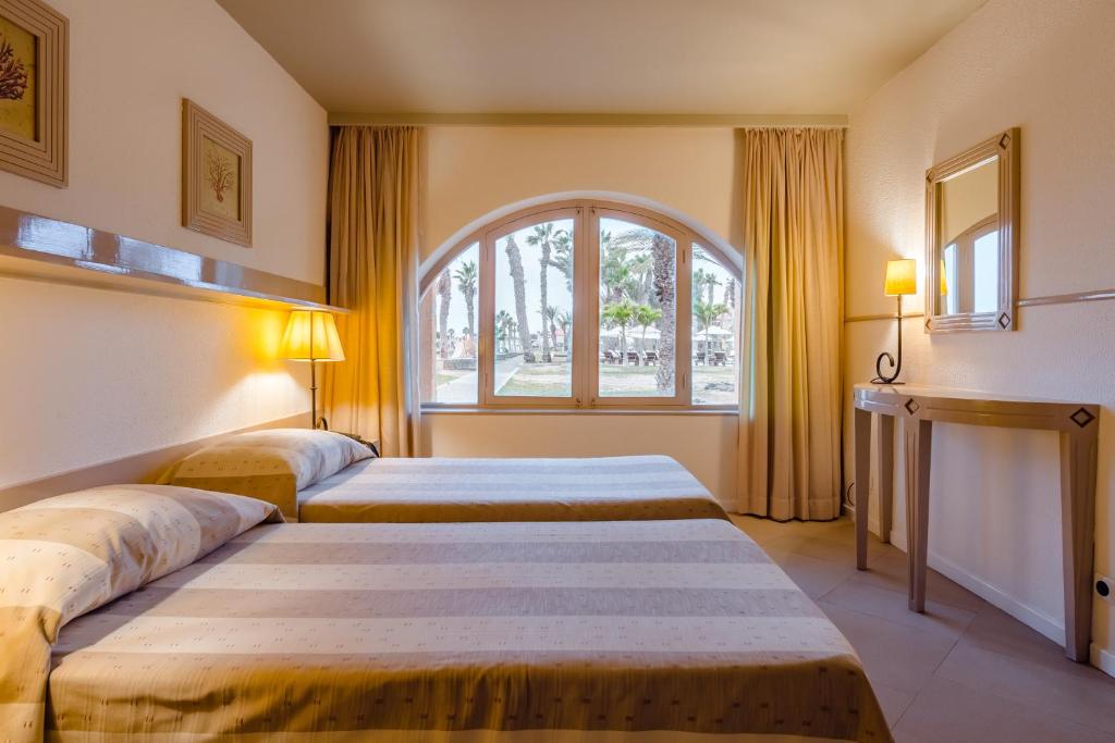 Postel nebo postele na pokoji v ubytování Hotel Morabeza