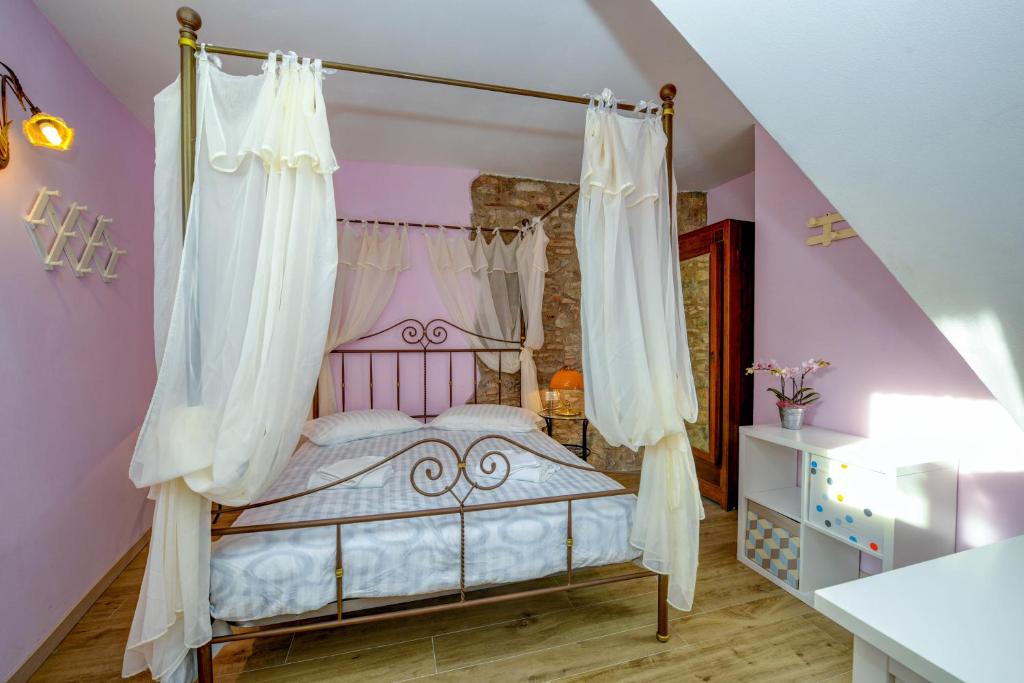 Tempat tidur dalam kamar di Casa nel Borgo - Il Picchio