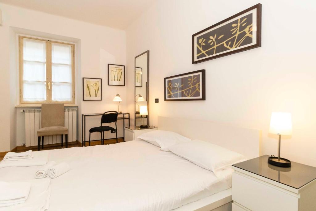 Posteľ alebo postele v izbe v ubytovaní Piazza Vittorio Veneto Central Apartment