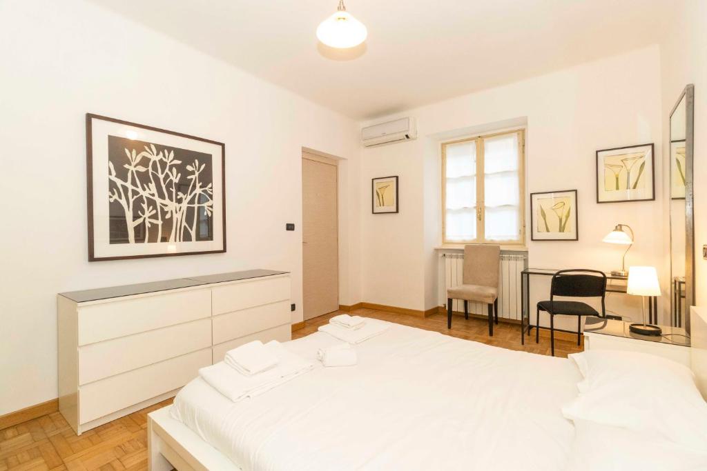 Posteľ alebo postele v izbe v ubytovaní Piazza Vittorio Veneto Central Apartment