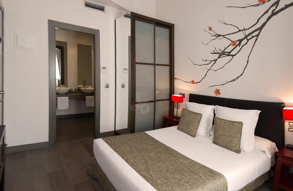 Кровать или кровати в номере Le Petit Boutique Hotel