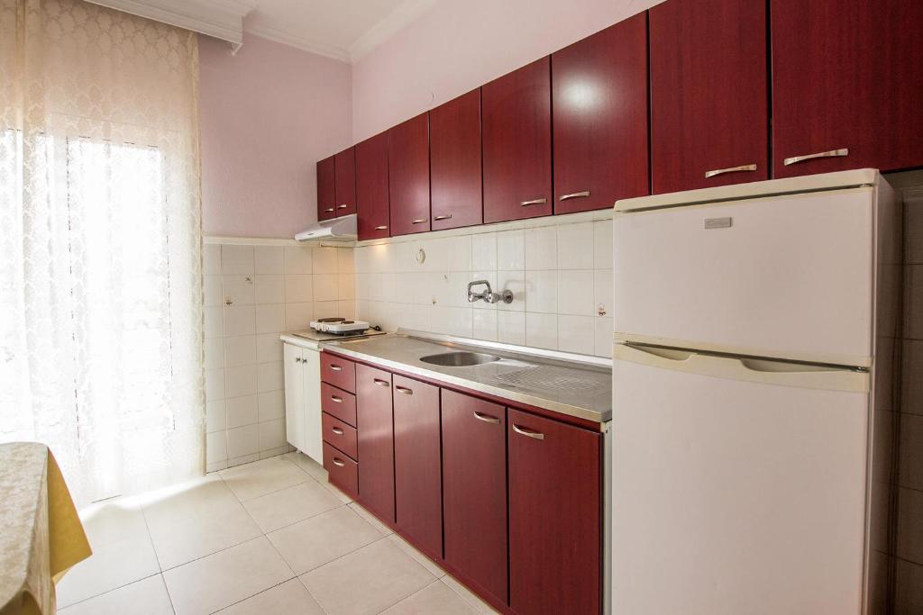 Kuchyň nebo kuchyňský kout v ubytování George Laz Rooms Nea Vrasna