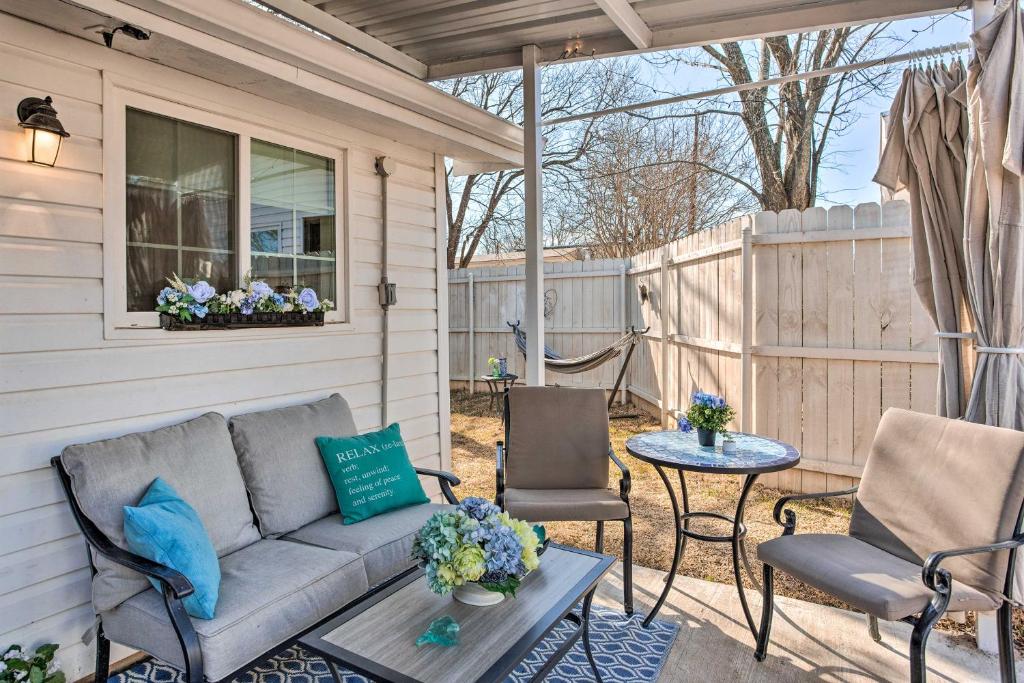 a patio with a couch and chairs and a table at 1 Mi to Lewisville Lake Fun Cozy Couples Retreat in Lake Dallas
