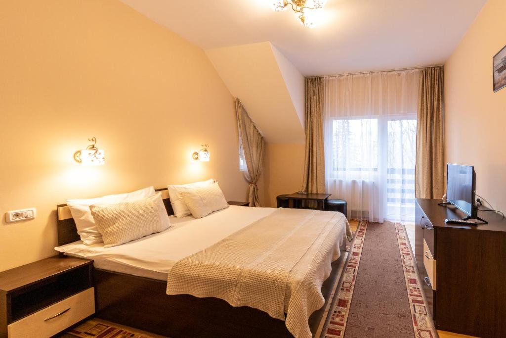 Postel nebo postele na pokoji v ubytování Pension Master
