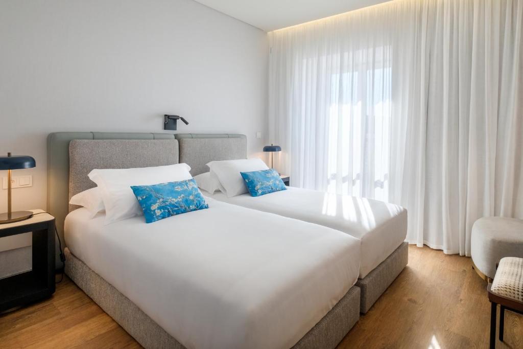 Katil atau katil-katil dalam bilik di MouraSuites Hotel