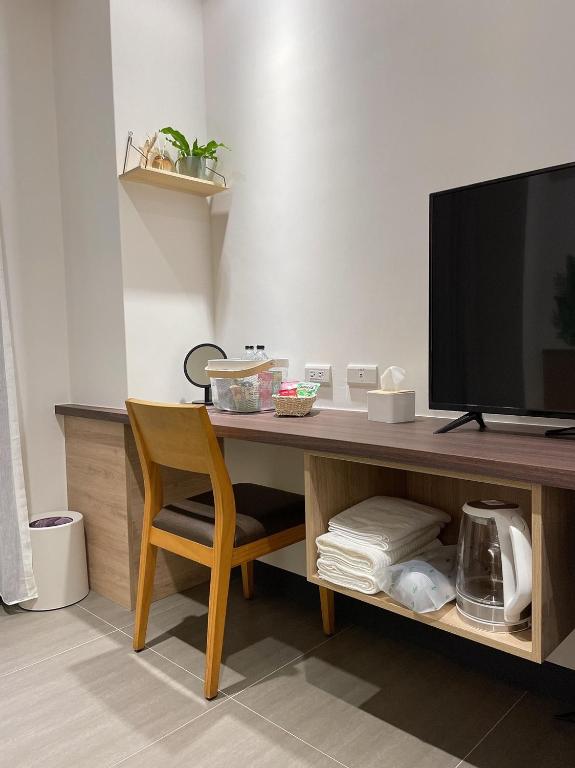 TV a/nebo společenská místnost v ubytování One Roll Stone Homestay