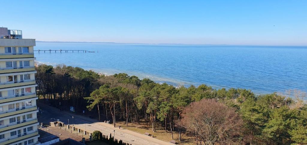 a view of the ocean from a building at Holiday Home Slavia New 810 z widokiem na morze in Międzyzdroje