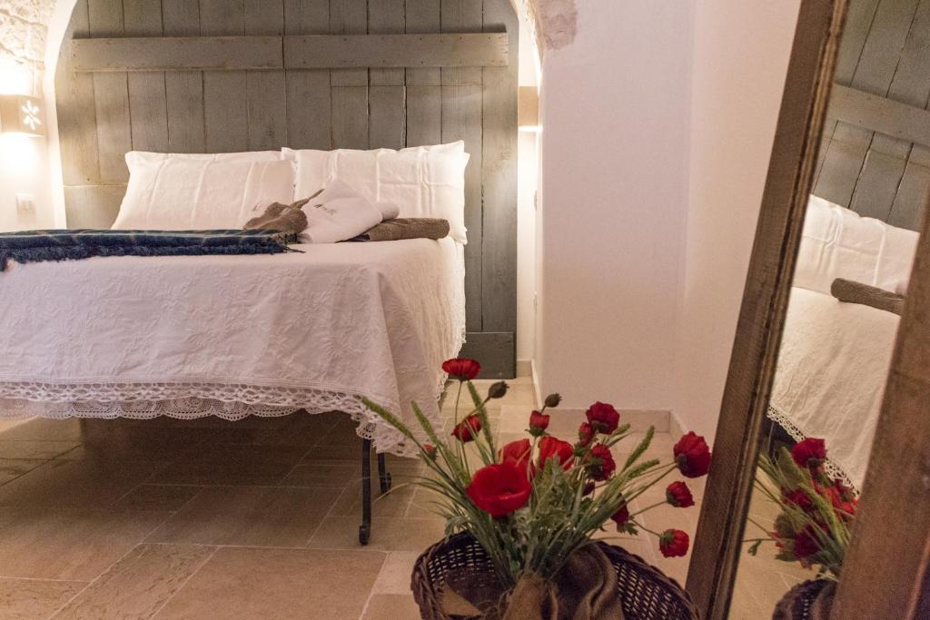 Posteľ alebo postele v izbe v ubytovaní Navolte Trulli e Quiete con Piscina