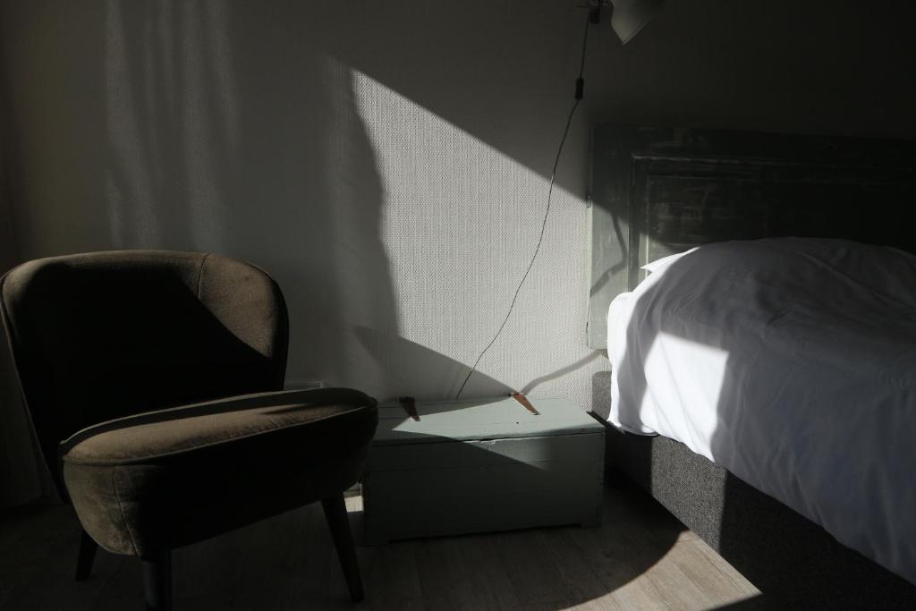 Postel nebo postele na pokoji v ubytování B&B - Pension Het Oude Dorp