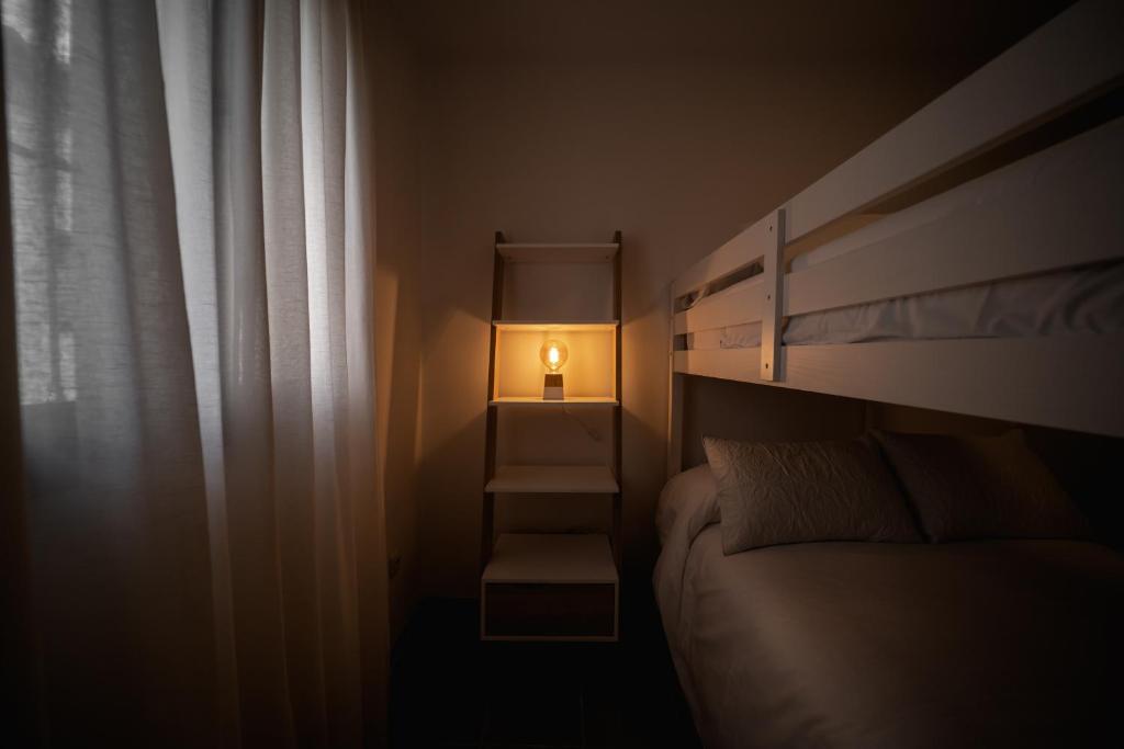 Łóżko lub łóżka w pokoju w obiekcie Duplex 8 Caños