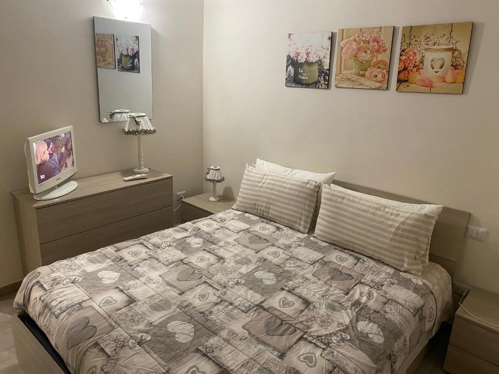 Ένα ή περισσότερα κρεβάτια σε δωμάτιο στο Lo Scalo Apartment
