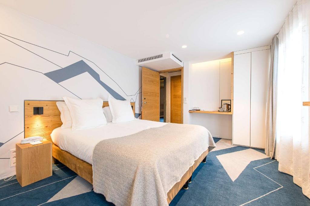 Postel nebo postele na pokoji v ubytování Best Western Chalet les Saytels