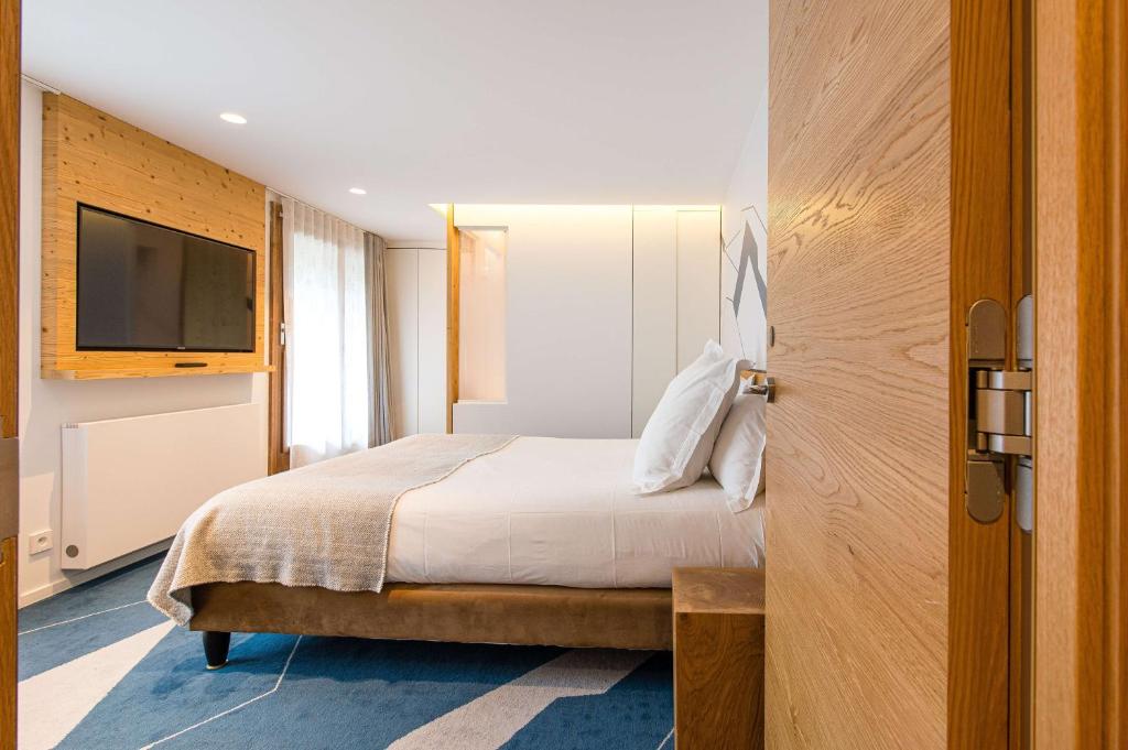 Postel nebo postele na pokoji v ubytování Best Western Chalet les Saytels