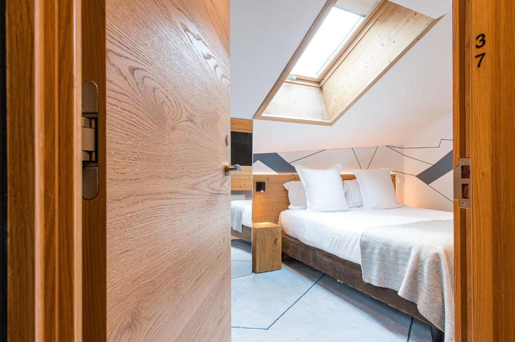 Postel nebo postele na pokoji v ubytování Best Western Chalet les Saytels