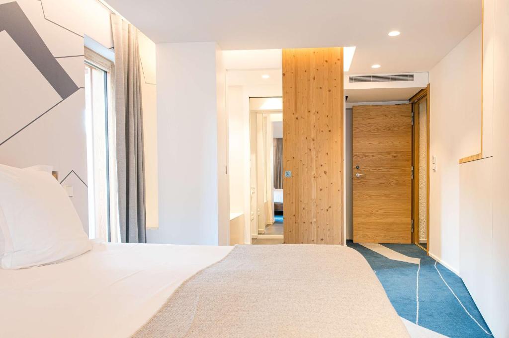 Postel nebo postele na pokoji v ubytování Best Western Chalet les Saytels