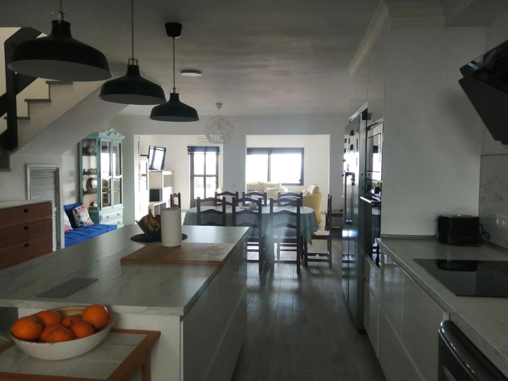 a kitchen with a bowl of oranges on a counter at Morro Mar in Morro del Jable