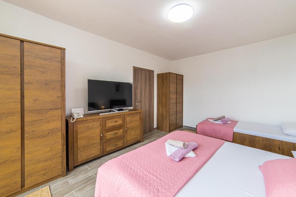 Postel nebo postele na pokoji v ubytování Apartment Sunrise Ploče