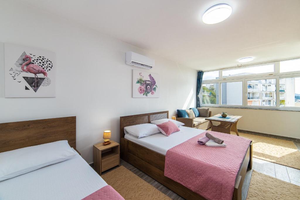 Postel nebo postele na pokoji v ubytování Apartment Sunrise Ploče