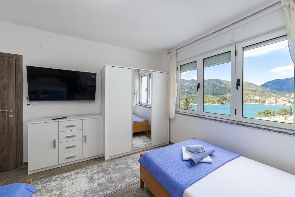 Postel nebo postele na pokoji v ubytování Apartment Sunrise Ploče