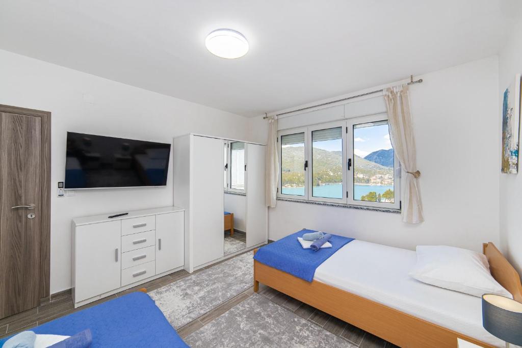 Postel nebo postele na pokoji v ubytování Apartment Sunrise Ploče
