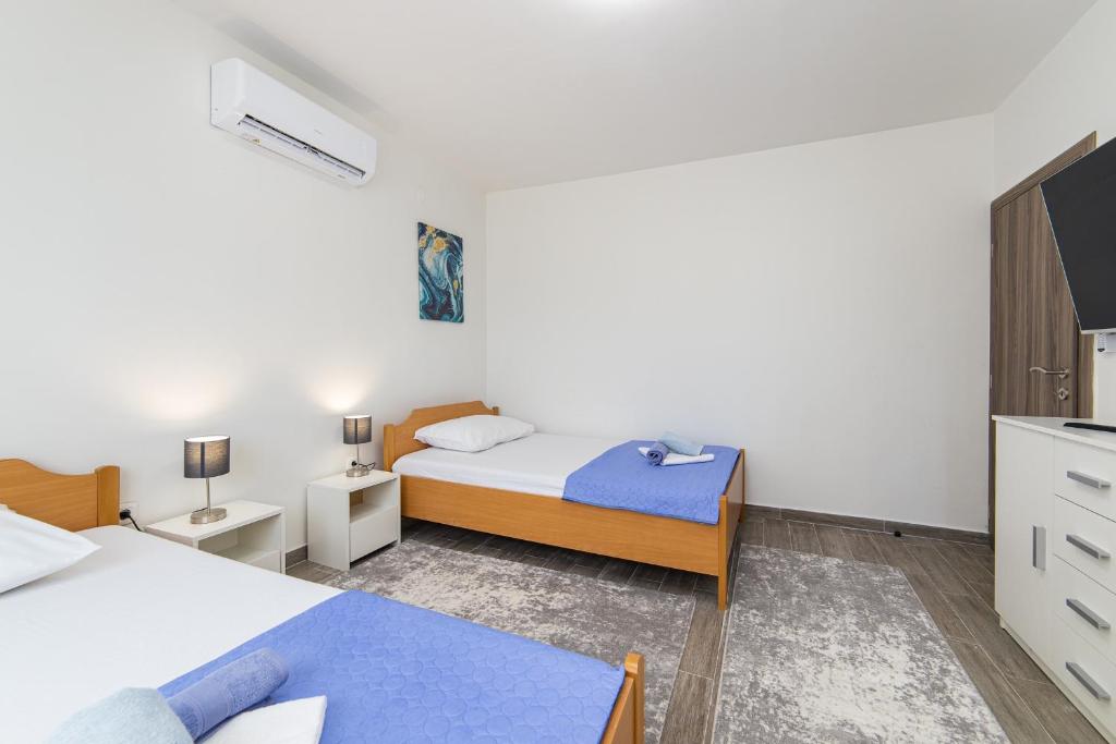 Postel nebo postele na pokoji v ubytování Apartment Sunrise Ploče