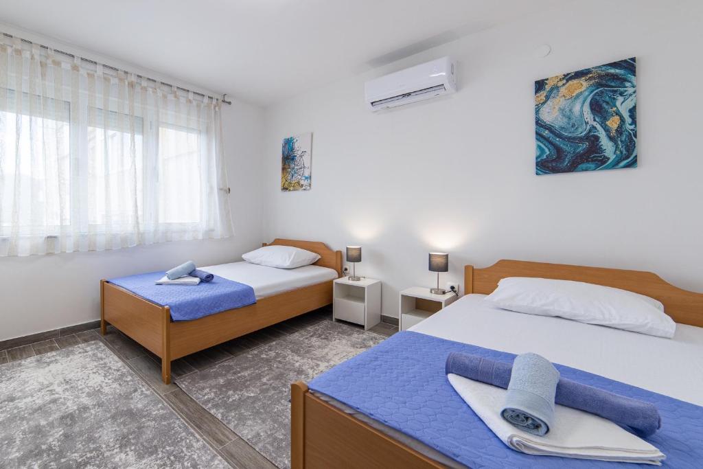 Postel nebo postele na pokoji v ubytování Apartment Sunrise Ploče