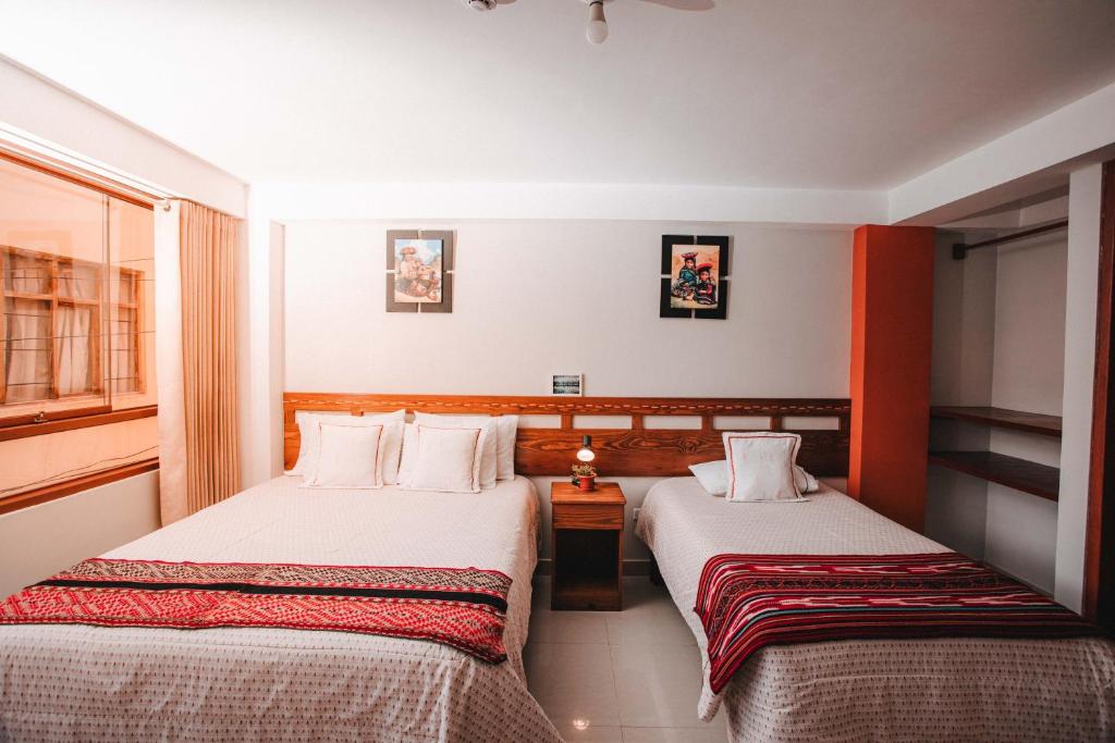 Postel nebo postele na pokoji v ubytování Dreams House Cusco