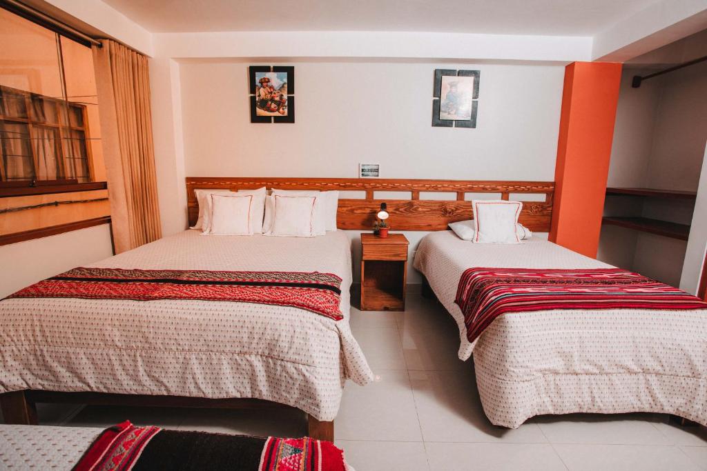 Postel nebo postele na pokoji v ubytování Dreams House Cusco
