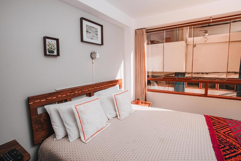 Postel nebo postele na pokoji v ubytování Dreams House Cusco