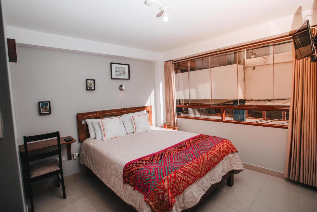 Postel nebo postele na pokoji v ubytování Dreams House Cusco