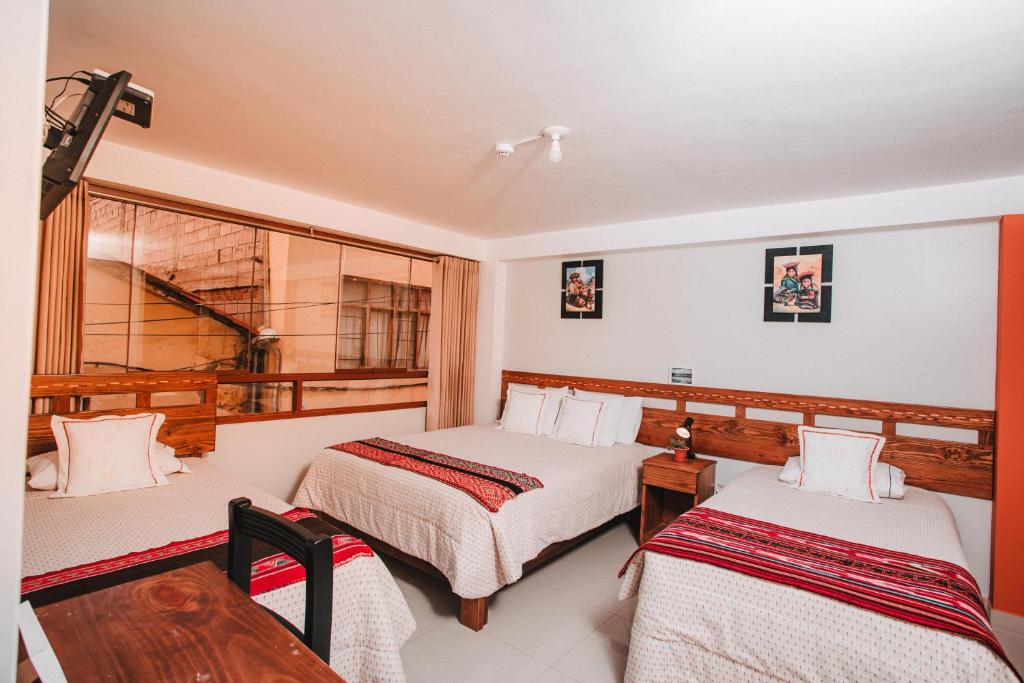 Postel nebo postele na pokoji v ubytování Dreams House Cusco