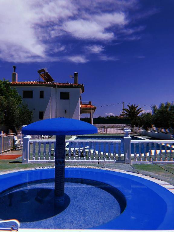 Bazén v ubytování Private villa en baza nebo v jeho okolí