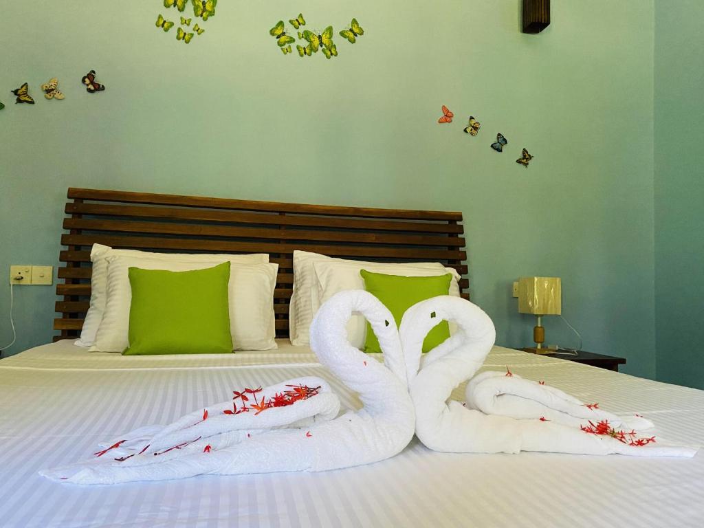 Postel nebo postele na pokoji v ubytování Sigiri Siesta Homestay