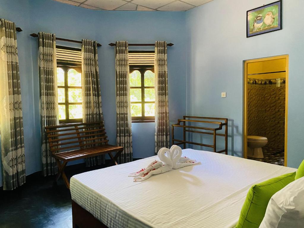 Postel nebo postele na pokoji v ubytování Sigiri Siesta Homestay
