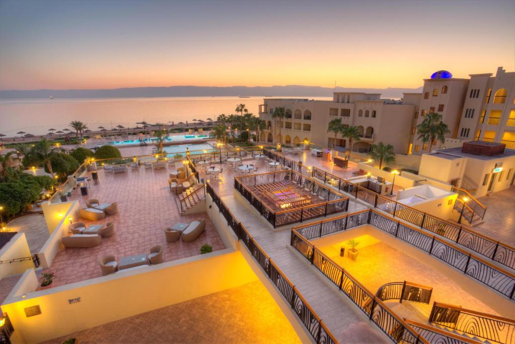 an aerial view of a resort with a swimming pool at Grand Tala Bay Resort Aqaba in Aqaba