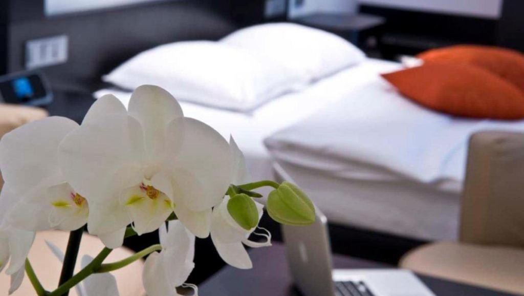 Postel nebo postele na pokoji v ubytování Cocoon Hotel La Rive