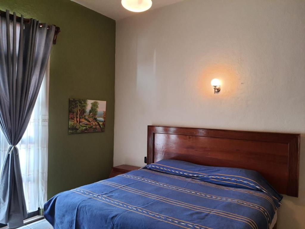 Katil atau katil-katil dalam bilik di HOTEL PUEBLO GRANDE